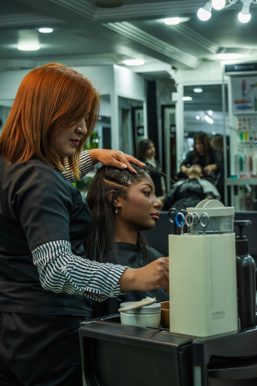 Hairdresser at work in a salon — the kind of trade operator Keppa was built for